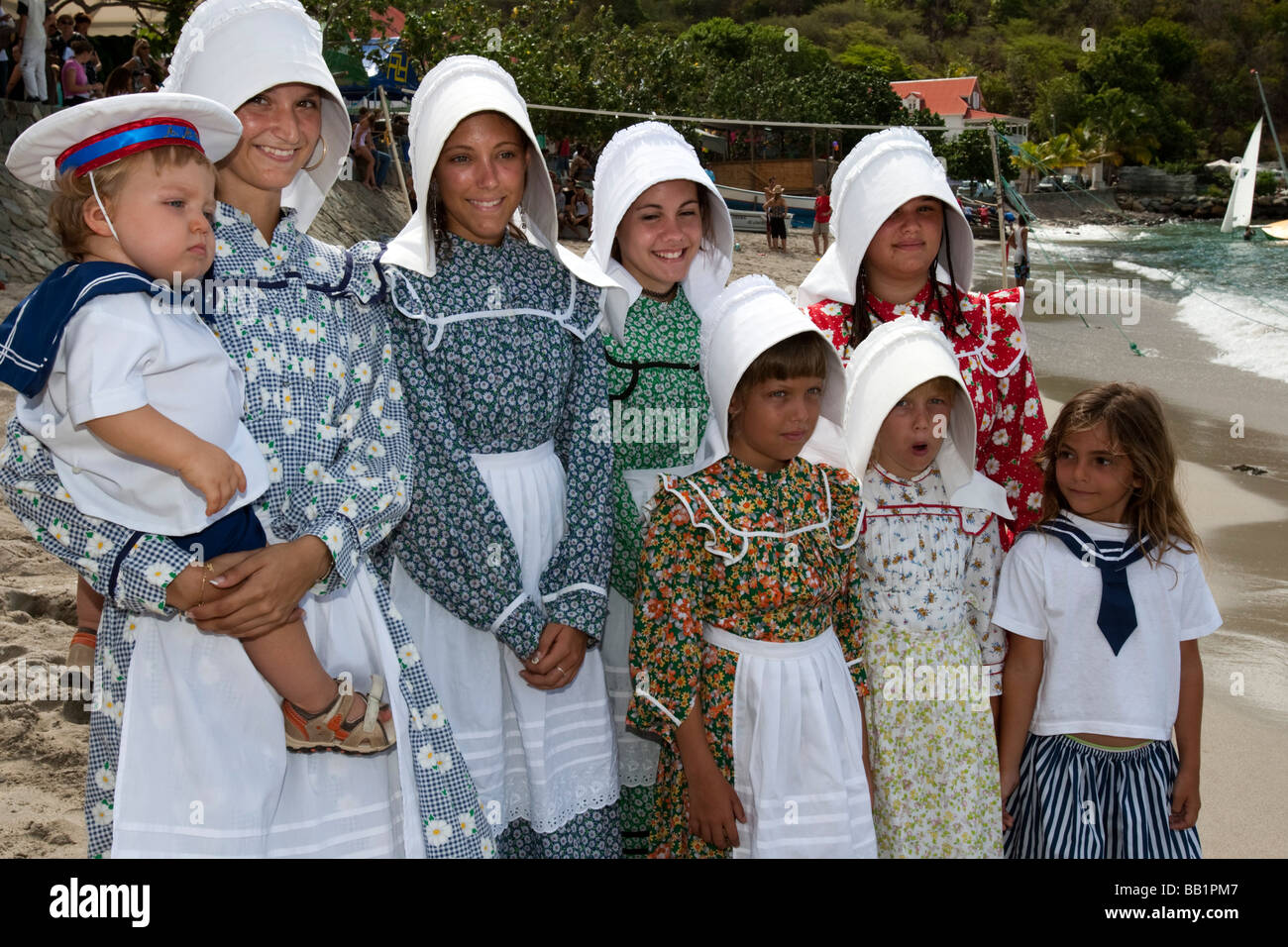 Young women and girls in traditional costume and bonnets Saint Louis Festival Corossol St Barts Stock Photo