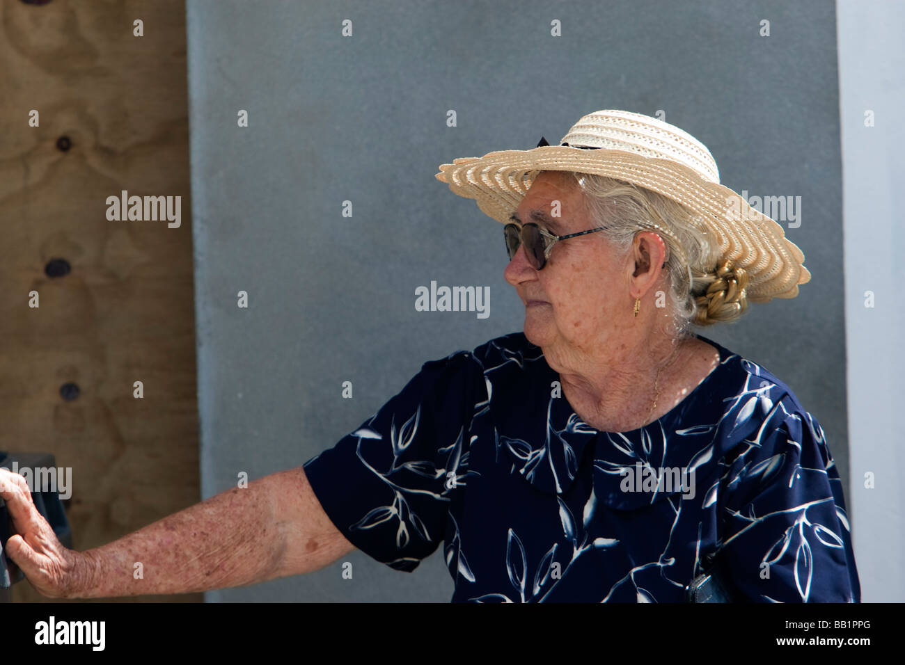 Elderly woman in traditional straw hat Saint Louis Festival Corossol St Barts Stock Photo