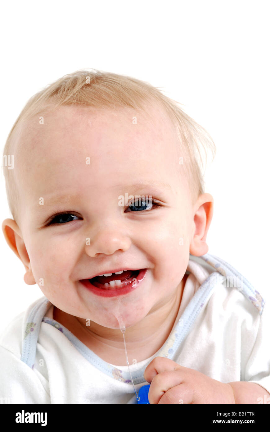 Baby boy crawling on floor smiling. Stock Photo