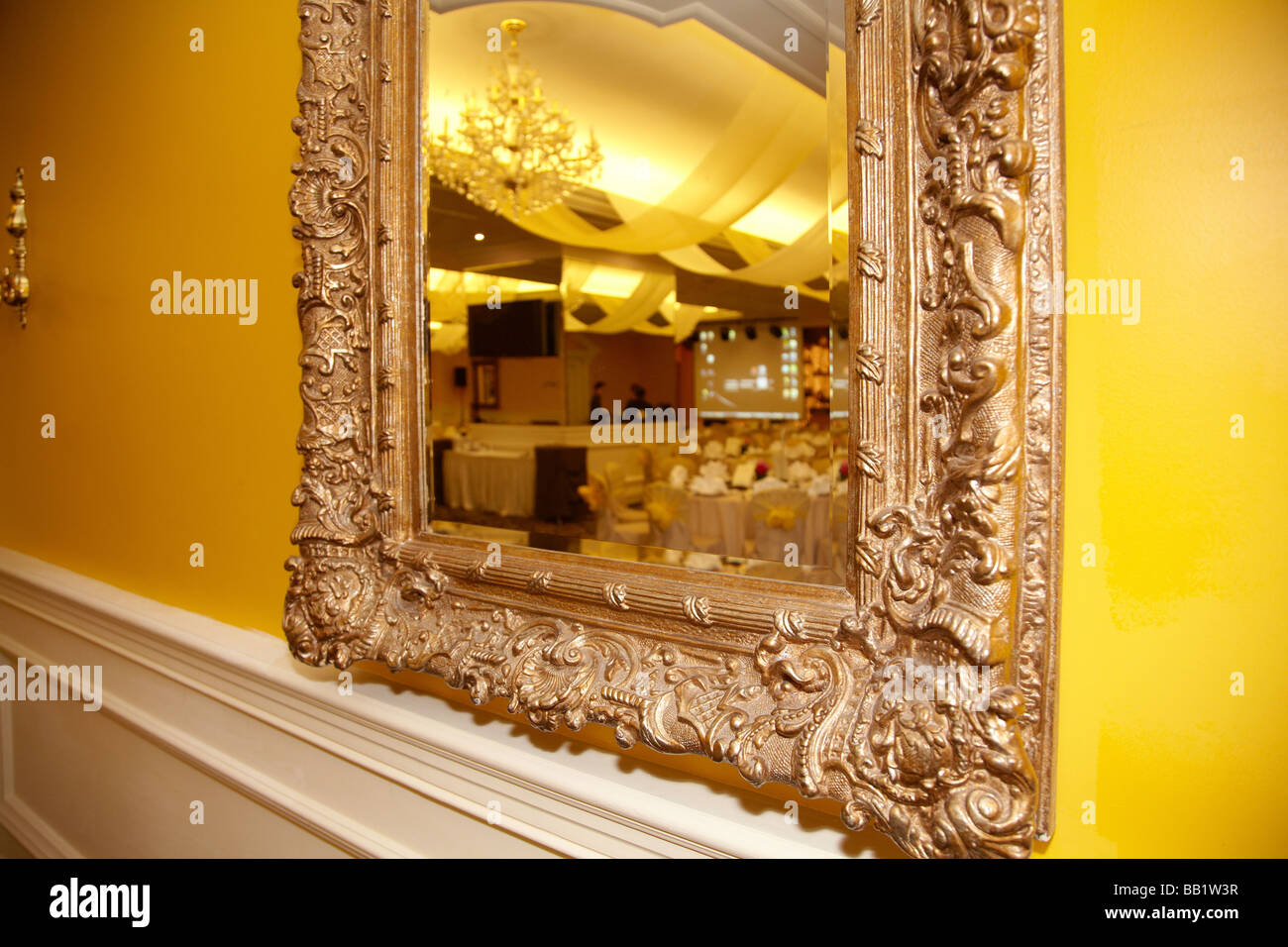 framed mirror hanging on wall Stock Photo - Alamy