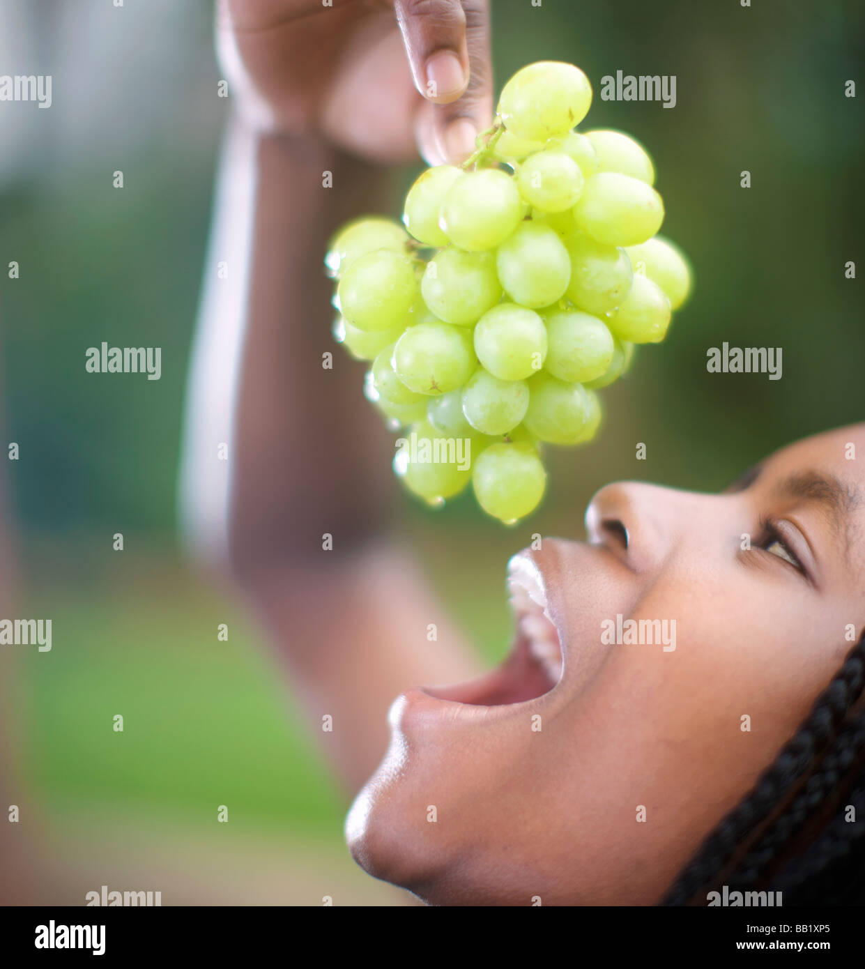 Woman eating grapes, Pietermaritzburg, KwaZuluNatal Province, South