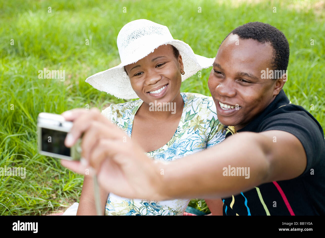Couple taking a self portrait with a digital camera, Johannesburg, Gauteng Province, South