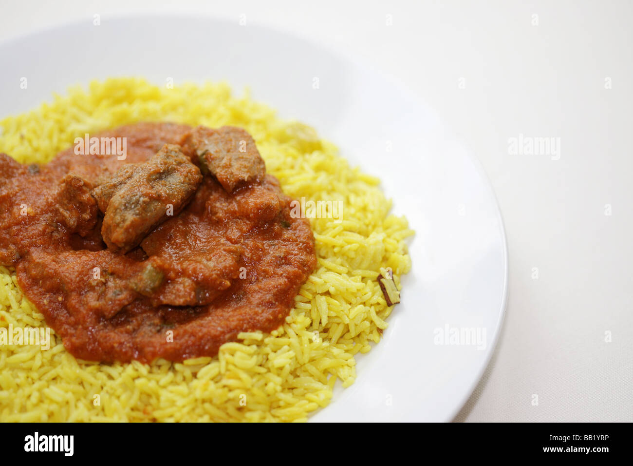 Authentic Indian Style Lamb Rogan Josh Curry With Yellow Aromatic Pilau