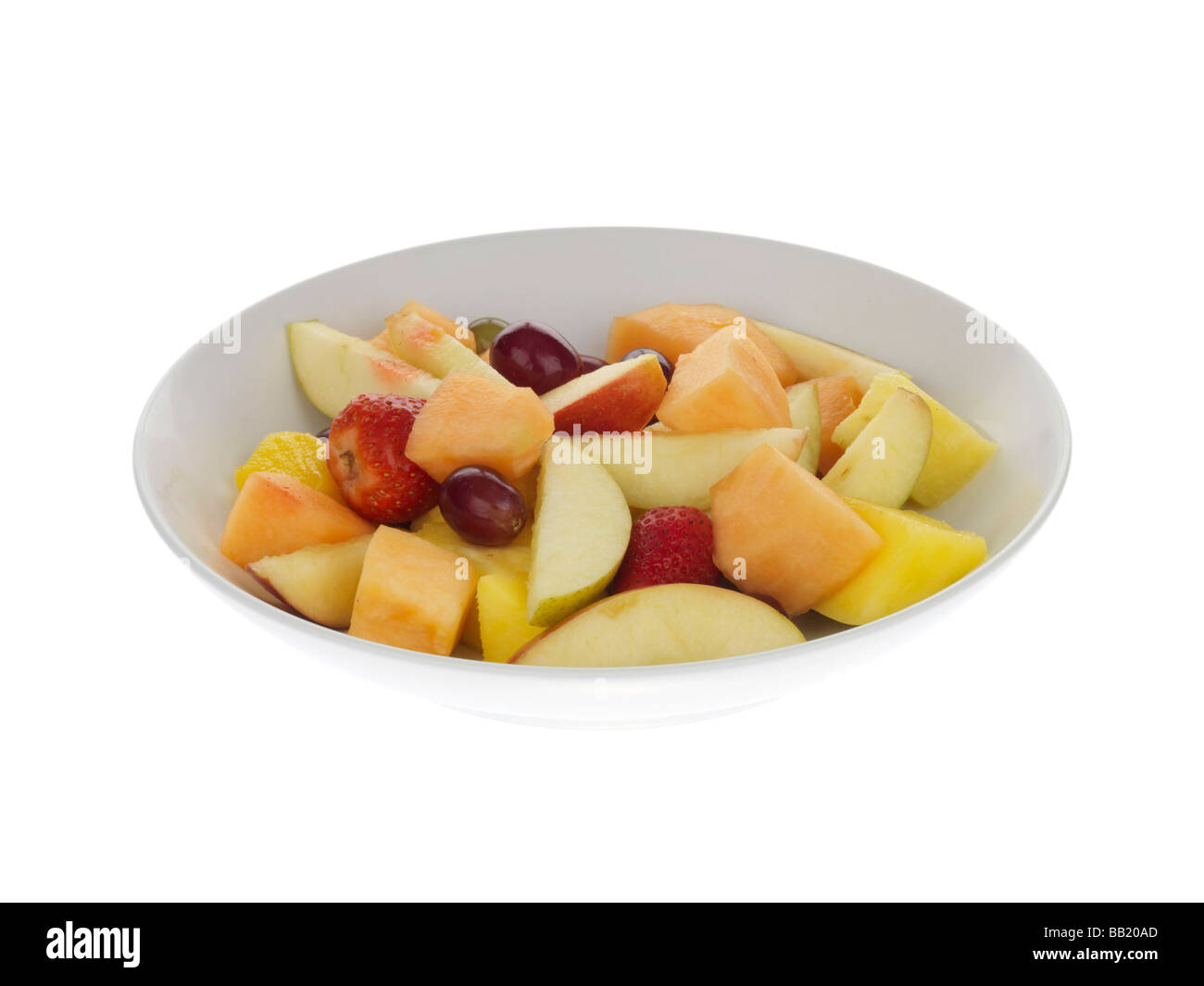 Fresh Healthy Bowl Of Organic Fruit Salad Isolated Against A White Background With No People And A Clipping Path Stock Photo