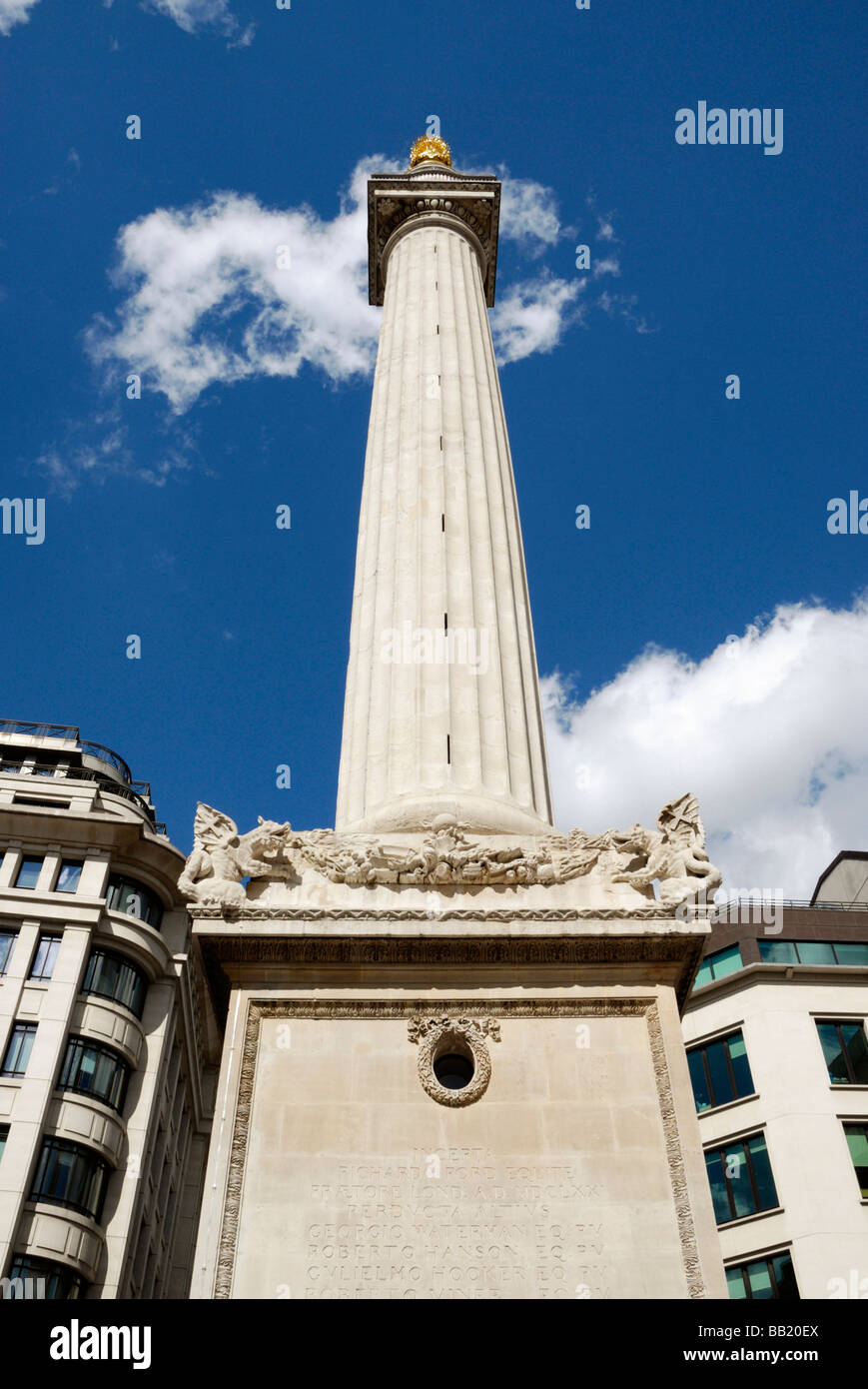 The recently restored Monument and surrounding office buildings in the City of London England. Stock Photo