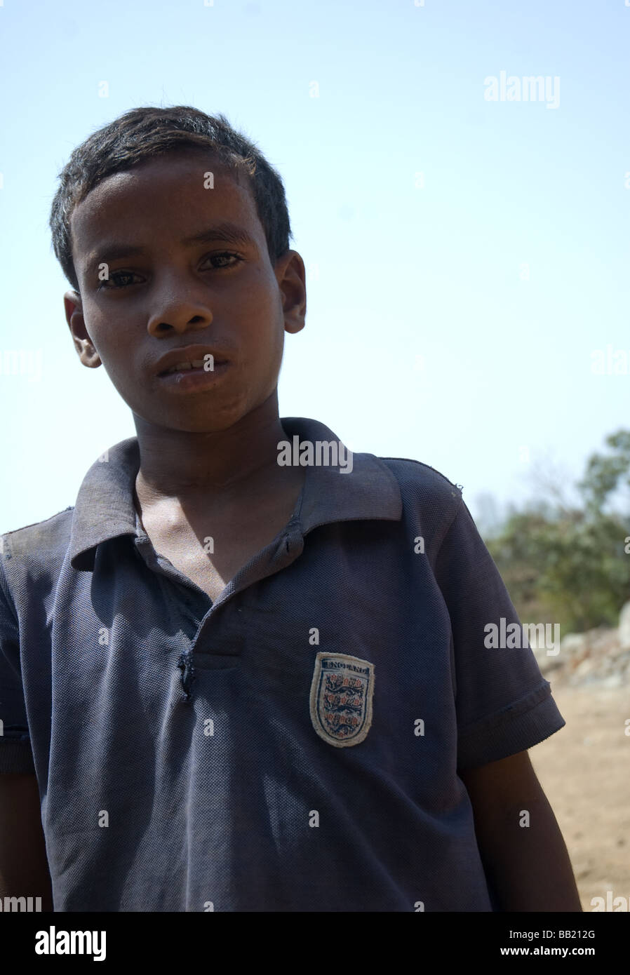 child beggar from mumbai, wearing a england shirt Stock Photo