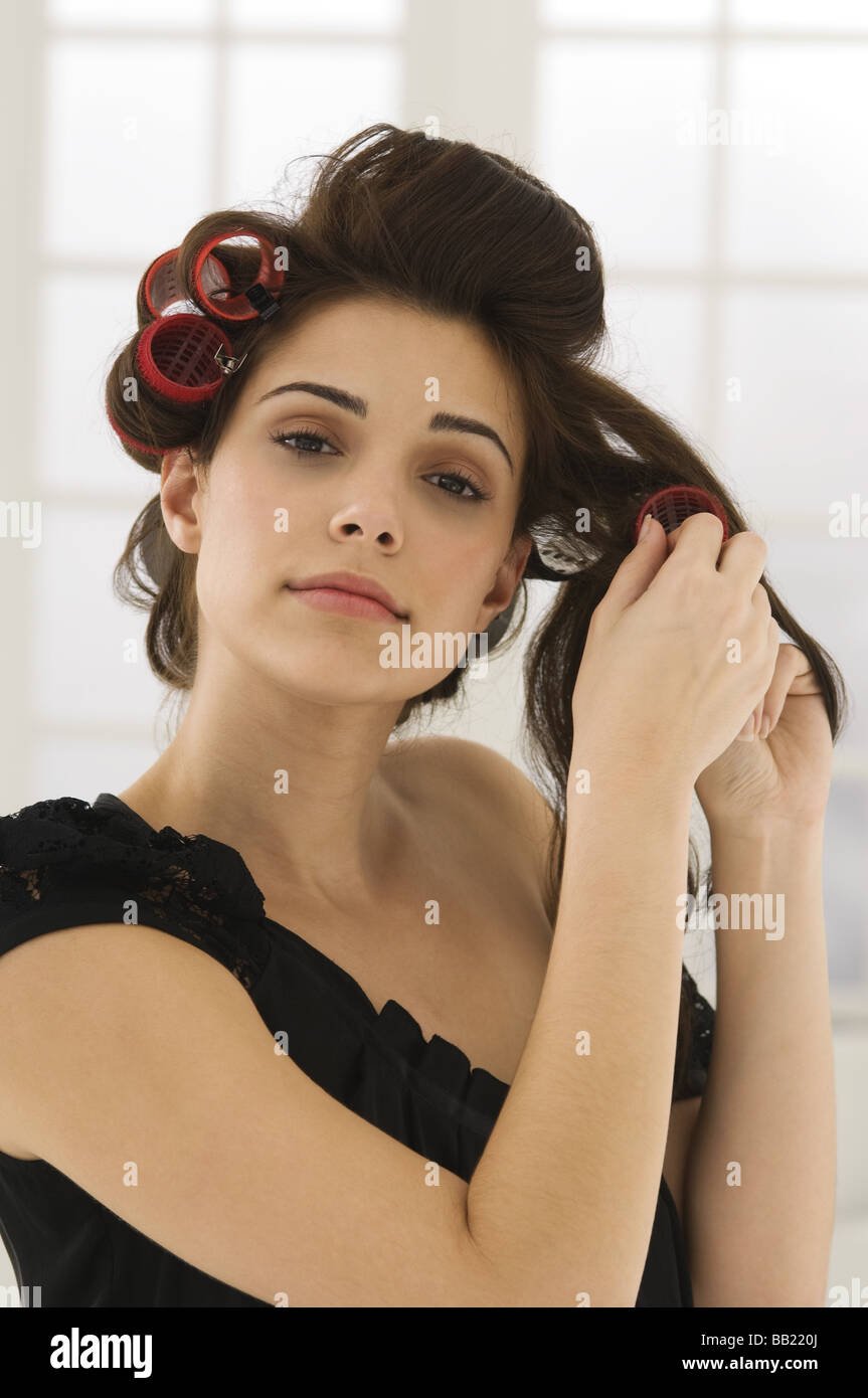 Portrait of a woman removing hair curlers Stock Photo Alamy