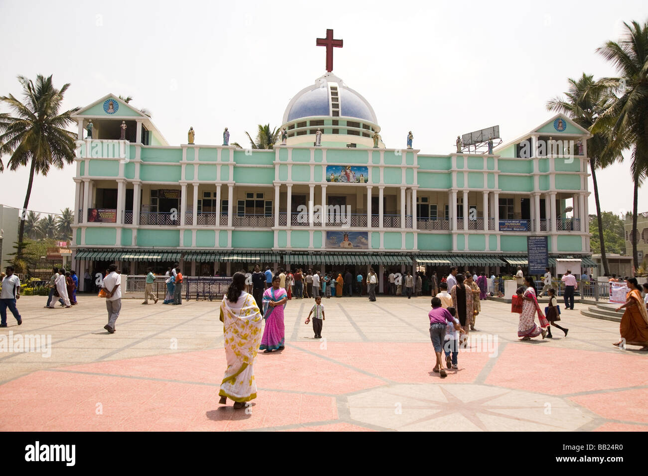 Indian people outside of the Church of the Infant Jesus in Bangalore, India. Stock Photo