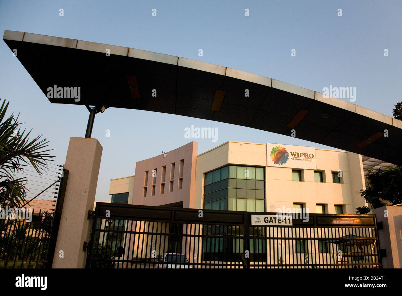 The gate of the Wipro campus one of the modern office buildings at Electronics City, a suburb of Bangalore, India. Stock Photo