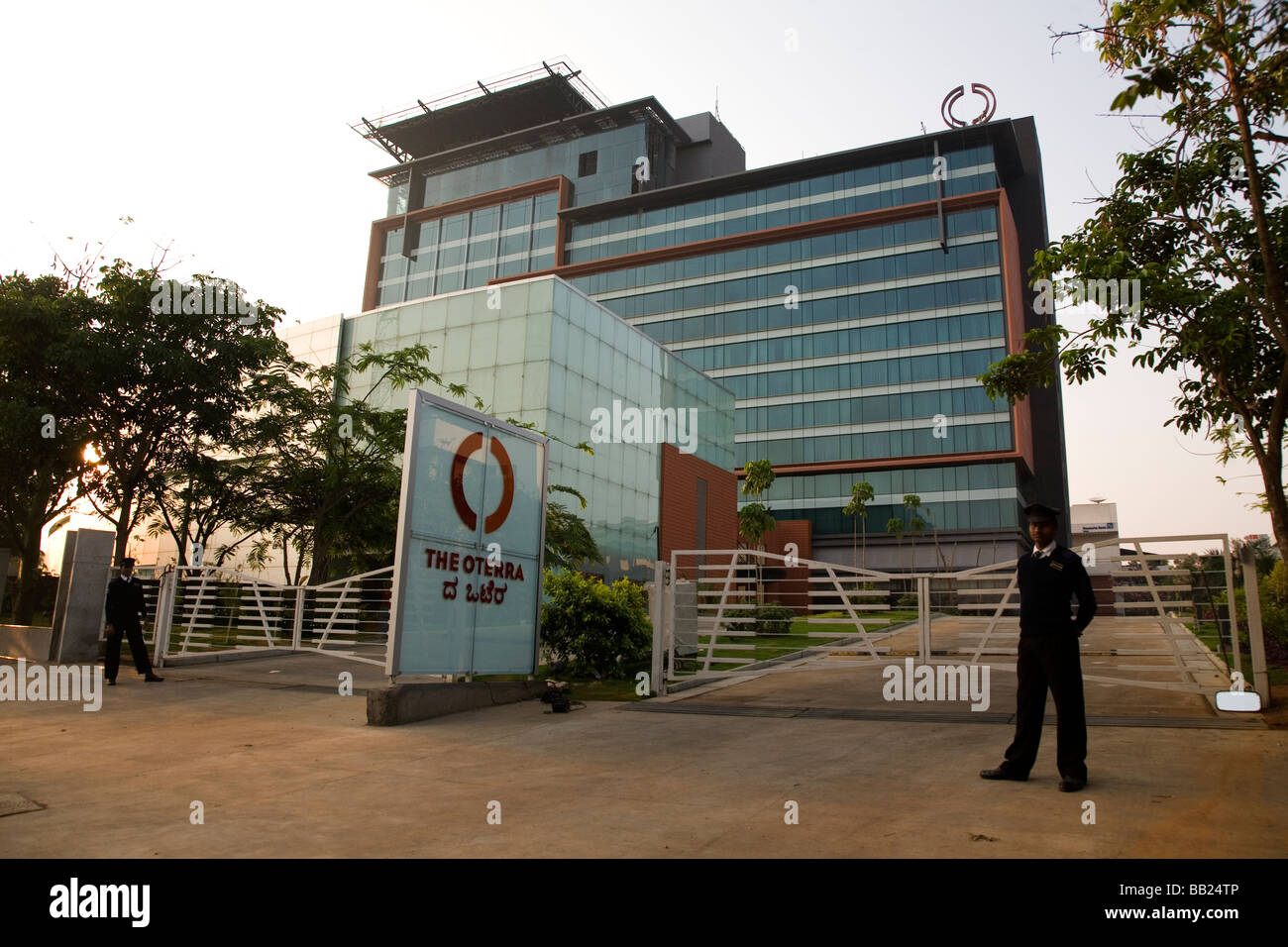 Security guards stand outside of Oterra, one of the modern office buildings within Electronics City, Bangalore. Stock Photo