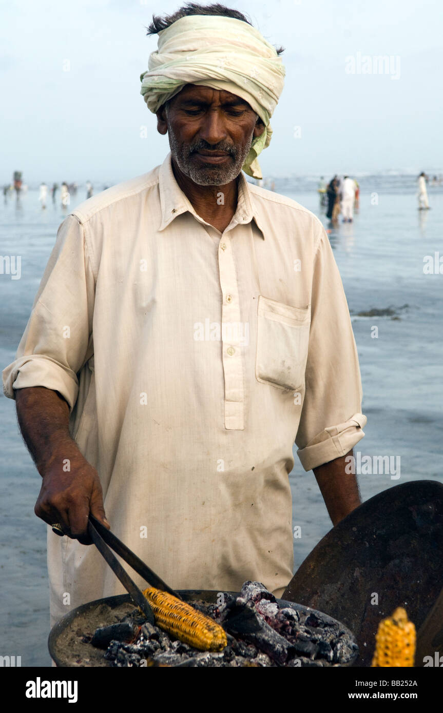 Selling corn on Clifton beach Karachi Pakistan Stock Photo Alamy