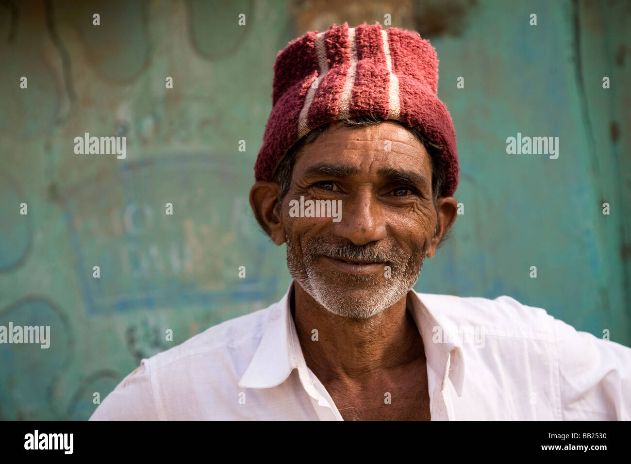 A man in the in the Gujarati town of Sasan, India. He wears a traditional Gujarati regional hat. Stock Photo