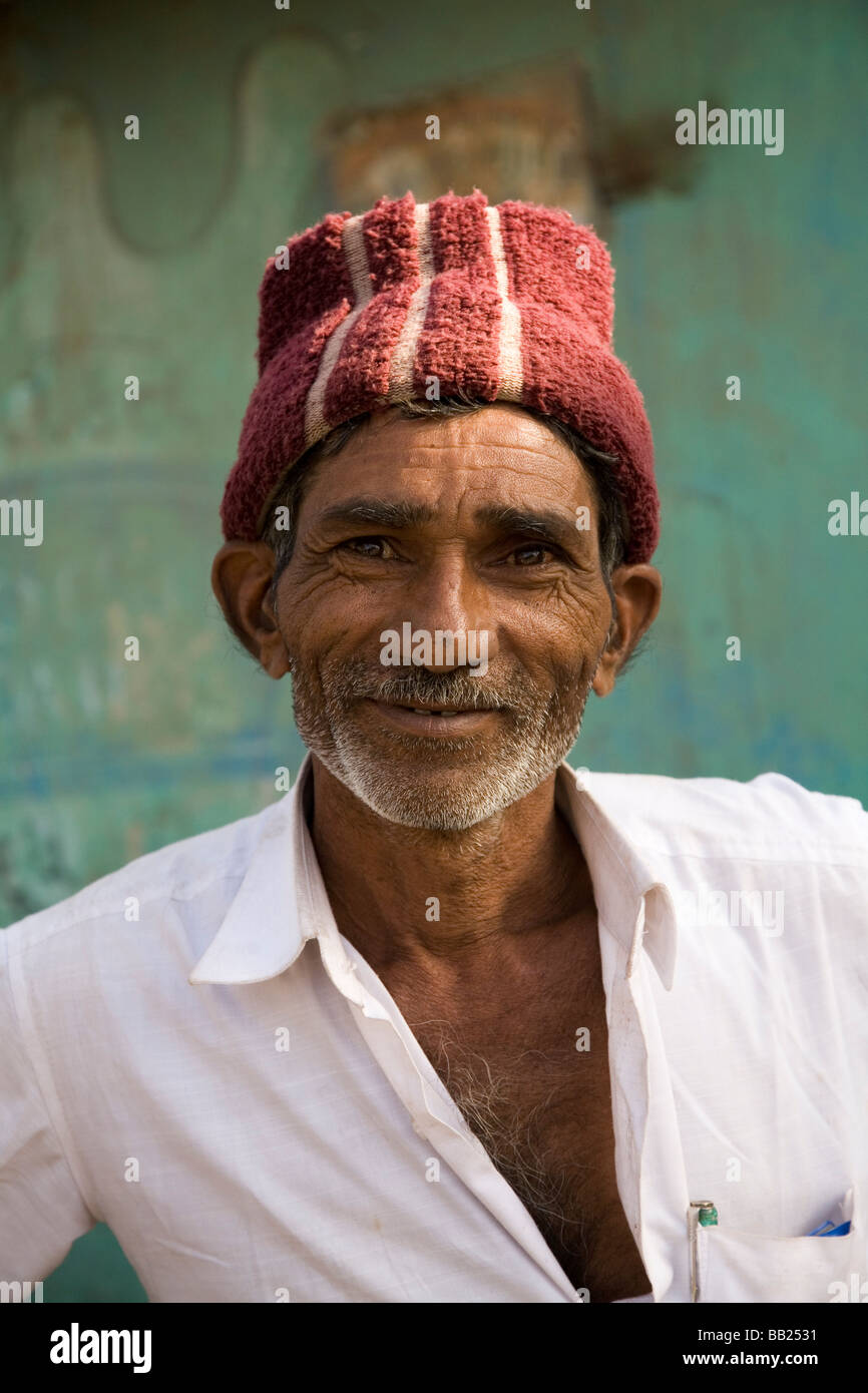 A man in the in the Gujarati town of Sasan, India. He wears a traditional Gujarati regional hat. Stock Photo