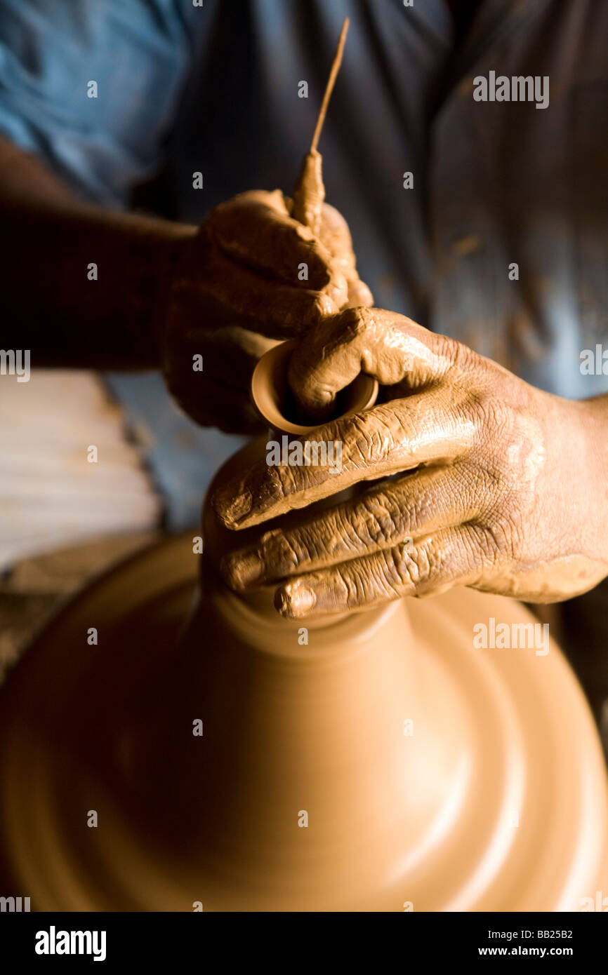 A potters hands at work on a revolving potters wheel in Bangalore