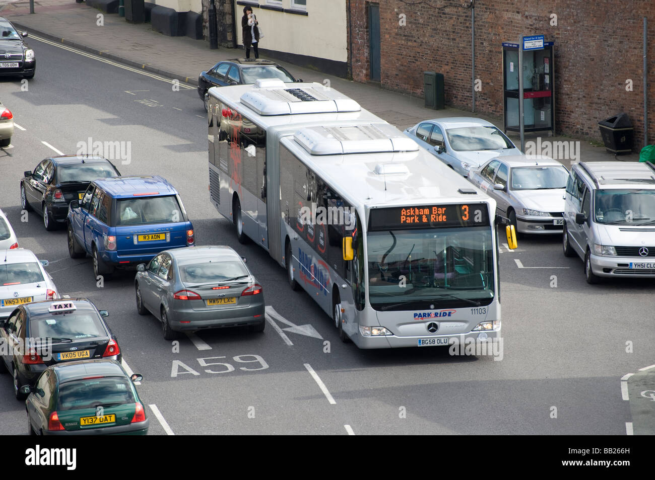 Silver bendy bus on a park and ride service in York city centre England ...
