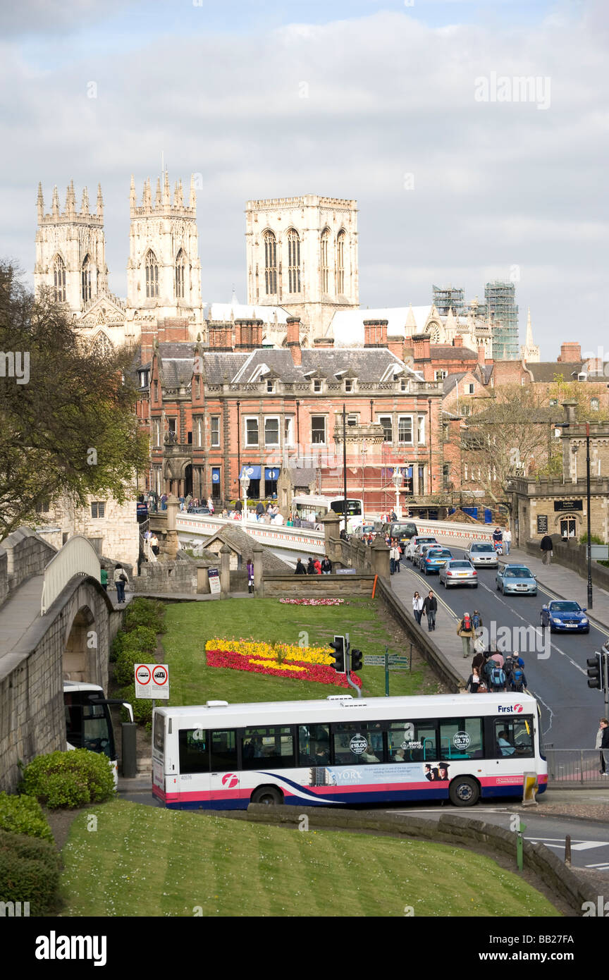 Buses in first group livery and traffic driving through York city centre in England Stock Photo