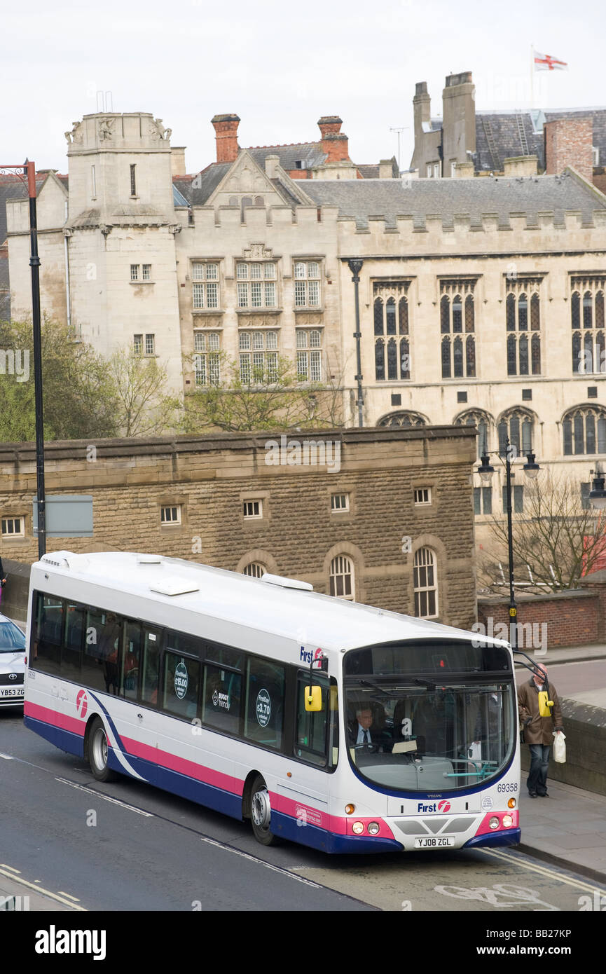 Single decker bus in first group livery driving through York city centre in England Stock Photo