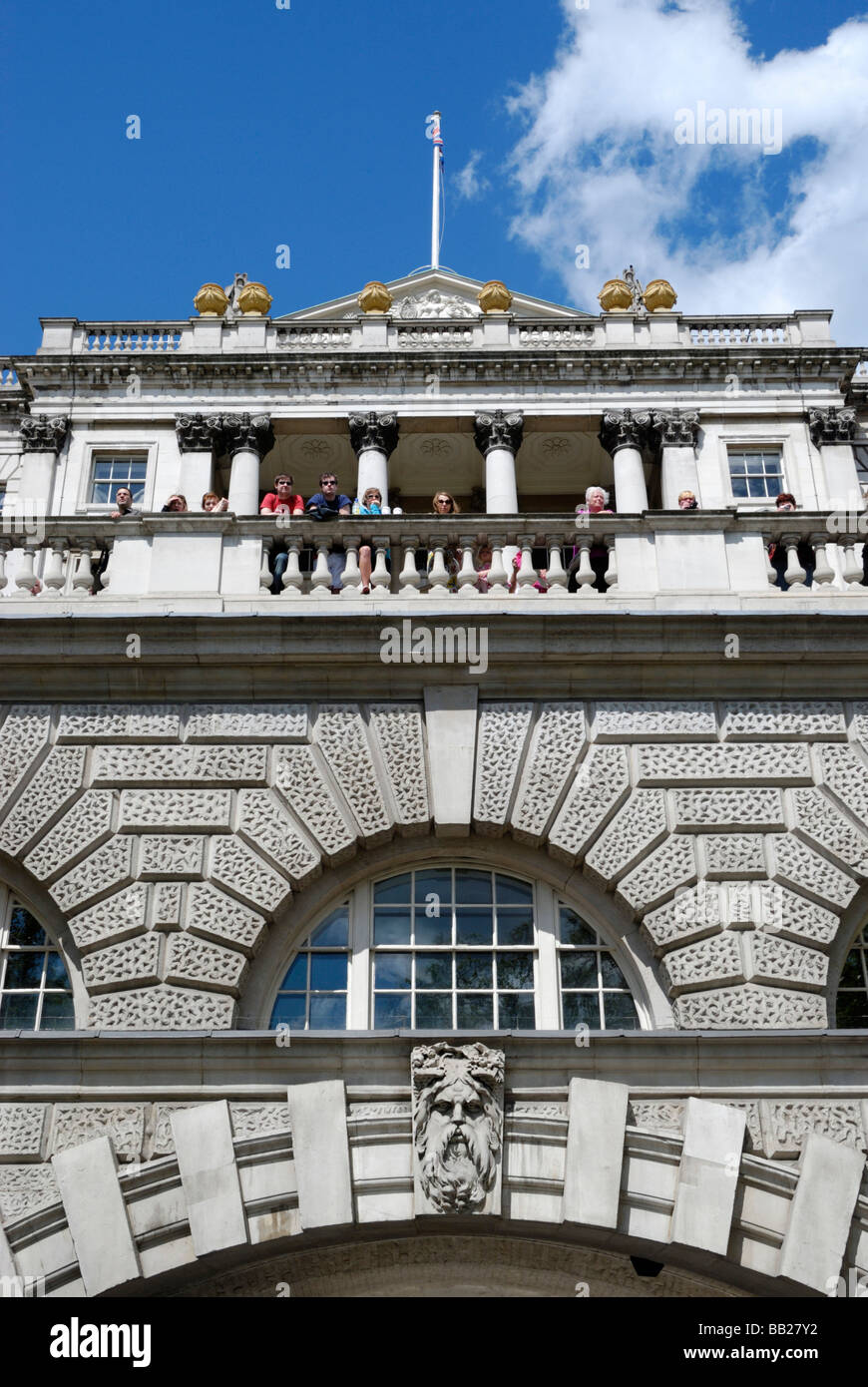 People looking over a balcony outside Somerset House London Stock Photo
