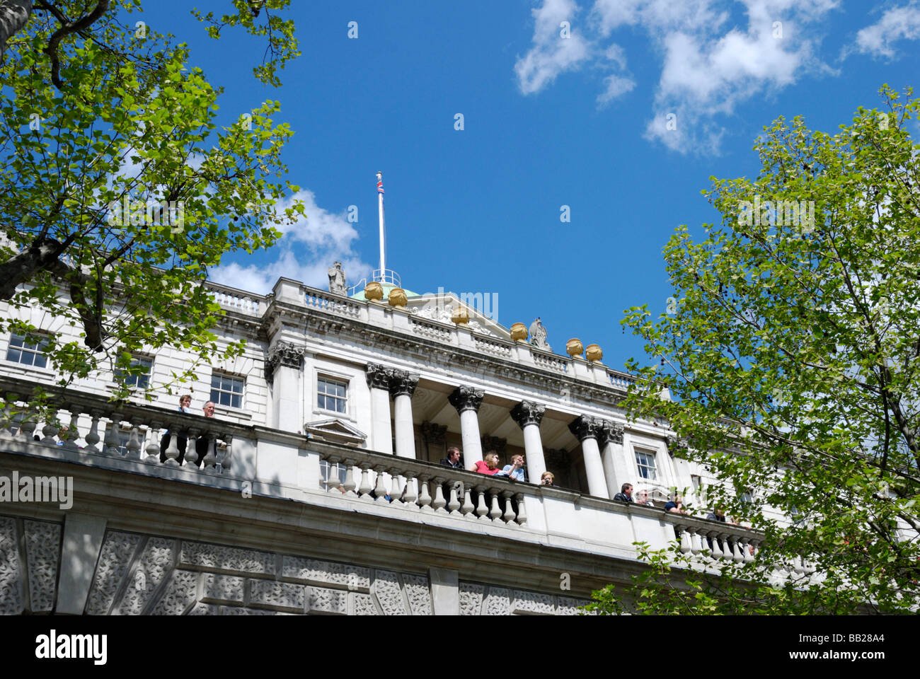 People looking over a balcony outside Somerset House London Stock Photo