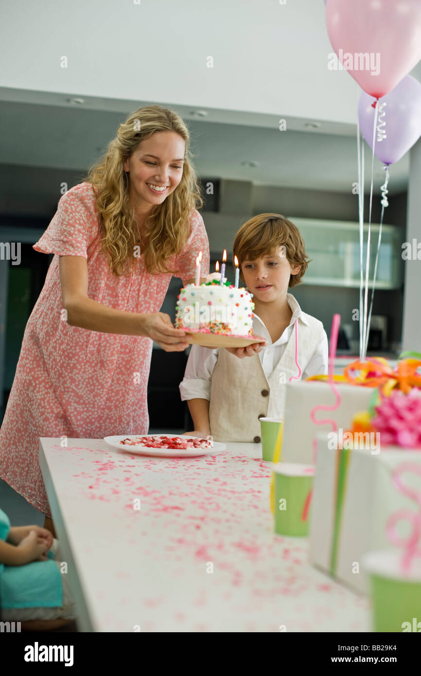 Woman holding a birthday cake Stock Photo - Alamy