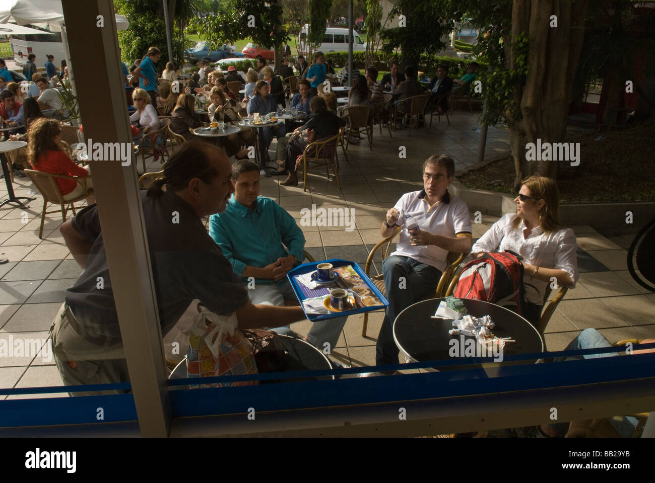 South America; Argentina; Buenos Aires.  People enjoy coffee and ice cream at an outdoor cafe in Recoleta. Stock Photo