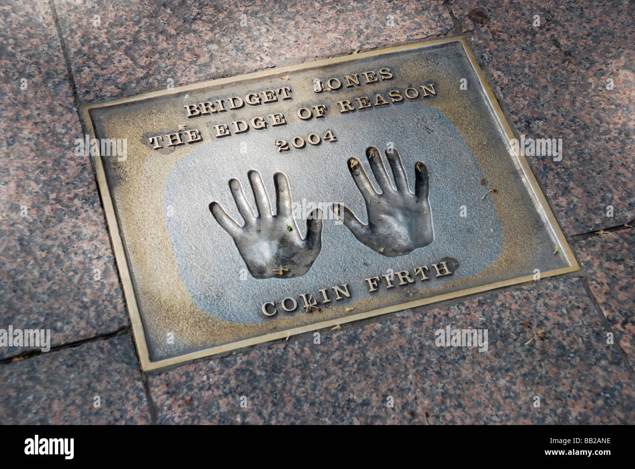 Colin Firth handprints in pavement commemorating the film Bridget Jones the Edge of Reason Leicester Square London Stock Photo