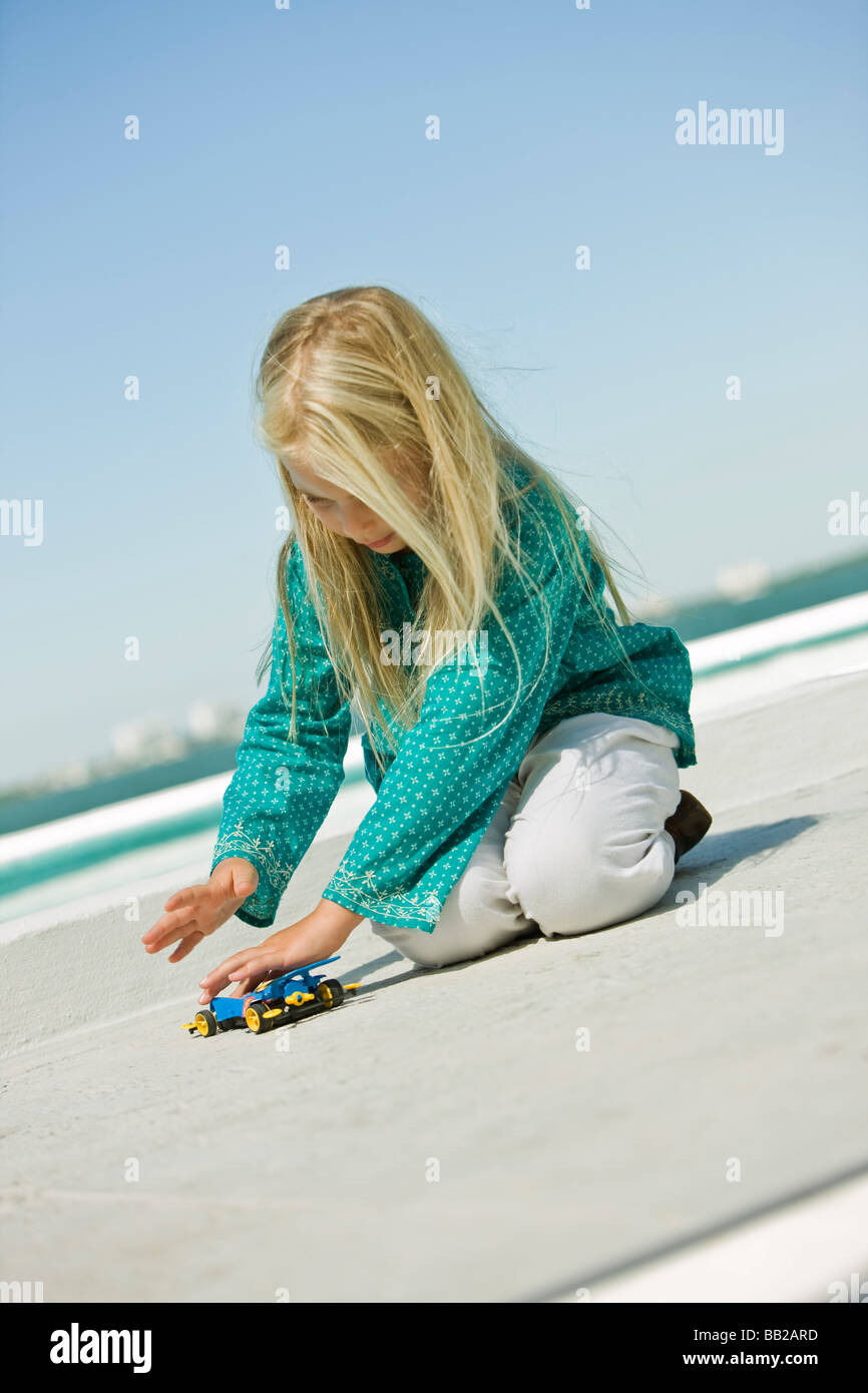 Girl playing with a remote controlled car Stock Photo Alamy