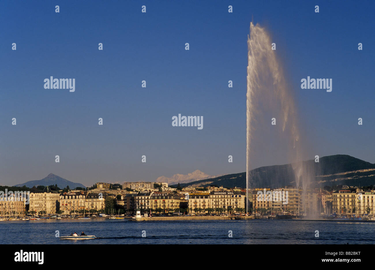 Jet d'Eau fountain at Lake Geneva with Alps in far distance Geneva Switzerland Stock Photo