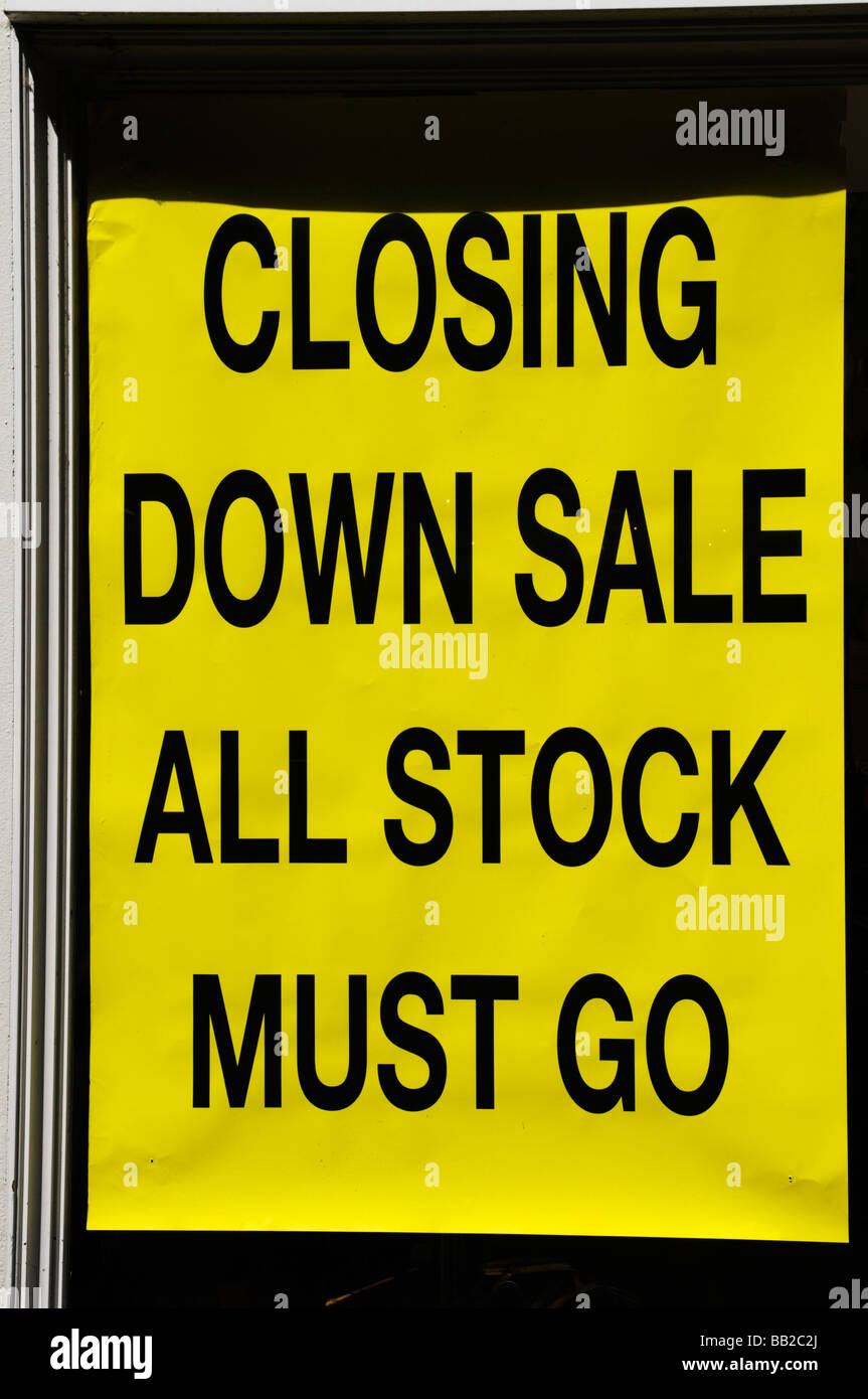 "Closing down sale all stock must go " notice in shoe shop "Closing down sale all stock must go " notice in shoe shop