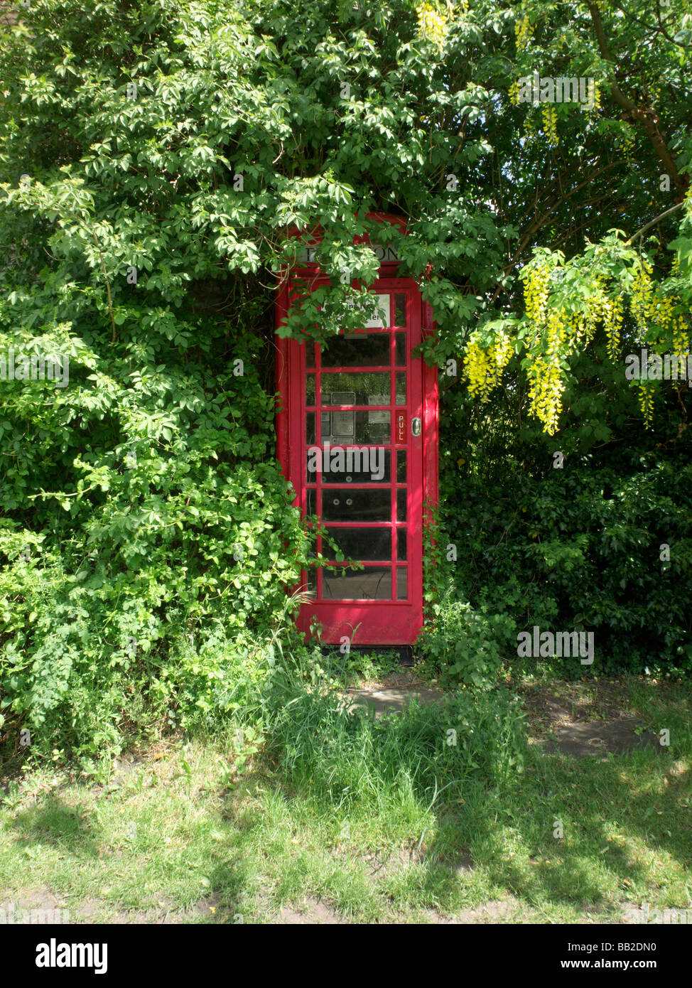 Two red telephone boxes in an english village Stock Photo Alamy
