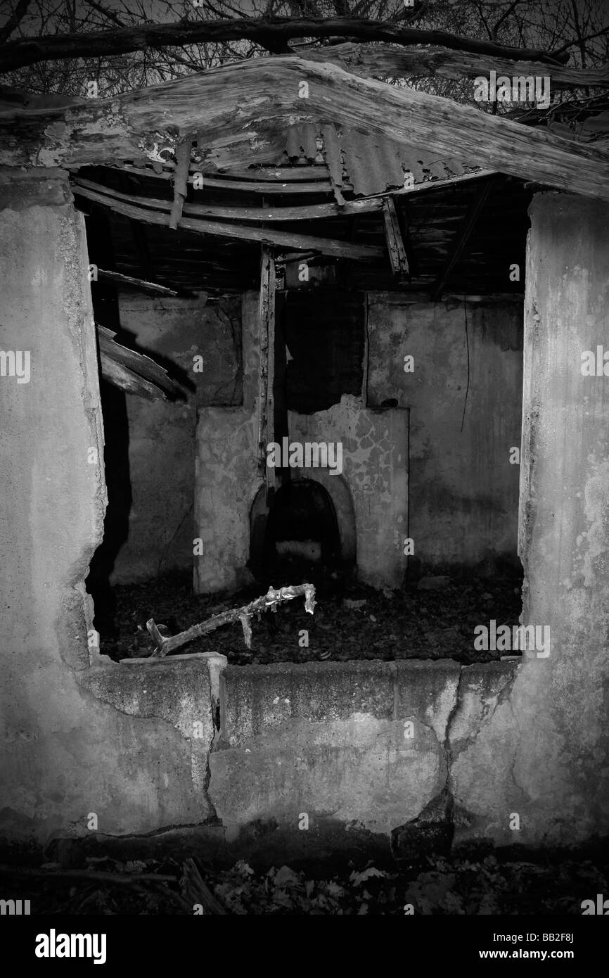 Fireplace and chimney in abandoned dilapidated witch's cottage Stock Photo