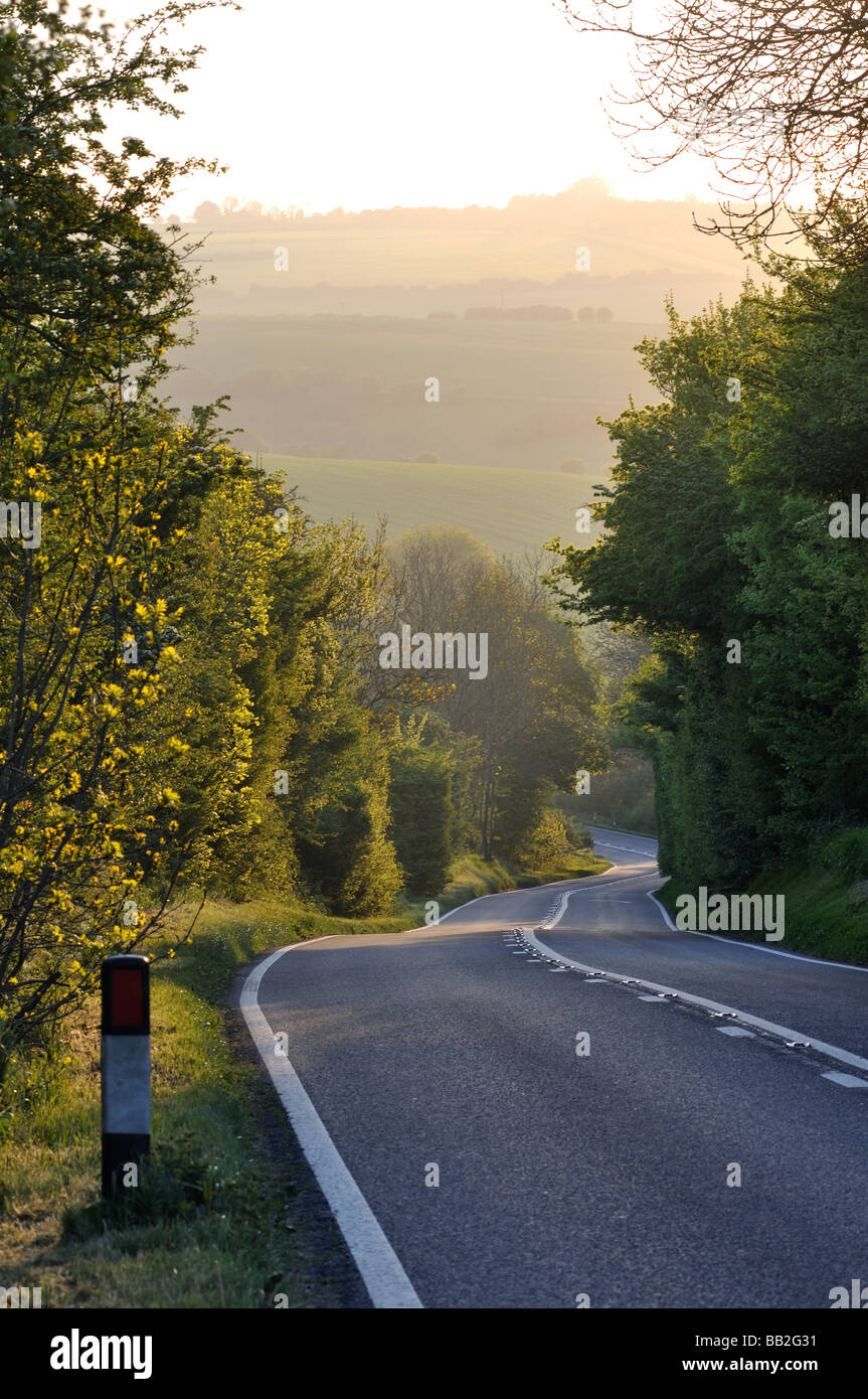 The Fosse Way at dawn near Farmington, Gloucestershire, England, UK Stock Photo