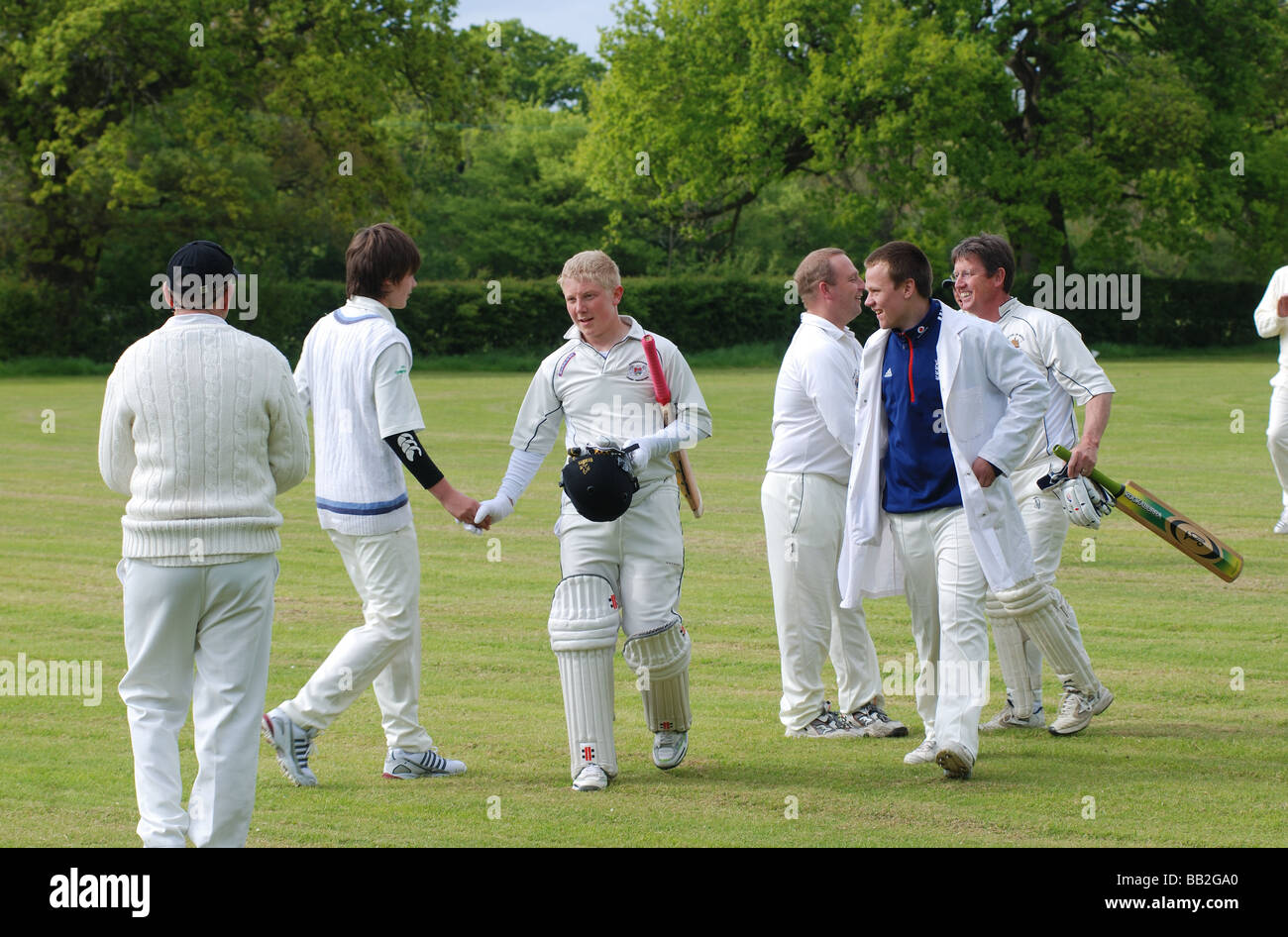 Village cricketers leaving pitch after innings, Hockley Heath, West Midlands, England, UK Stock Photo