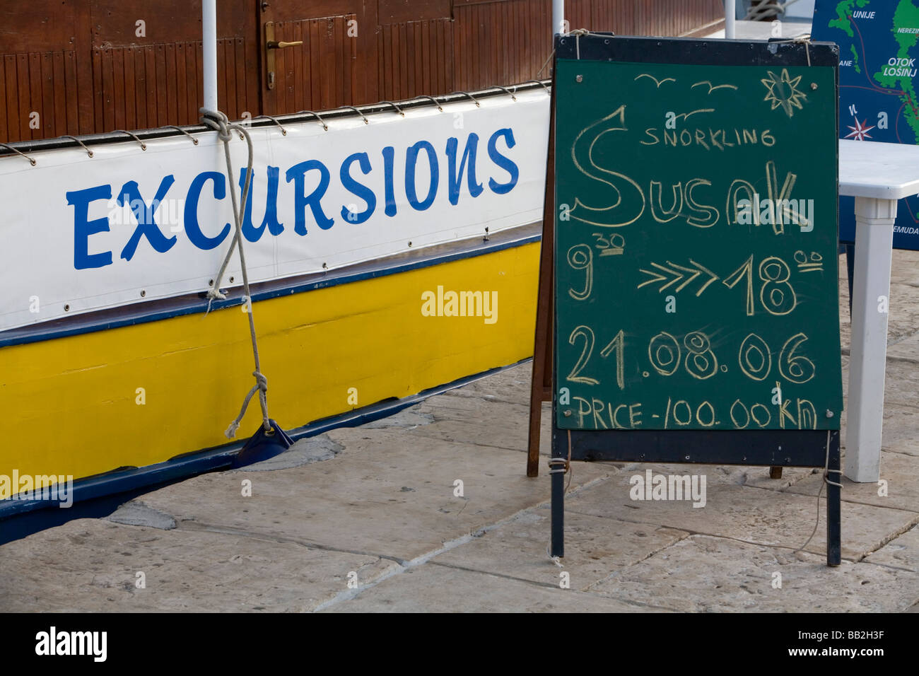 Traveling Croatia; Detail of a boat with a sign offering excursions. Stock Photo