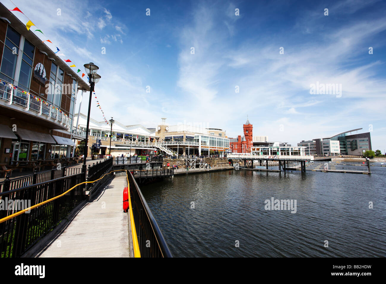 Wide view of Wales tourist attraction Cardiff Bay waterfront area with inner harbour Pierhead and Assembly buildings behind Stock Photo
