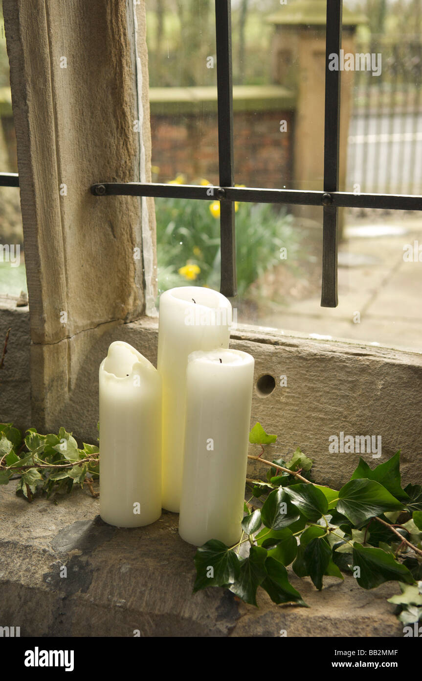 Candles on window sill Stock Photo Alamy