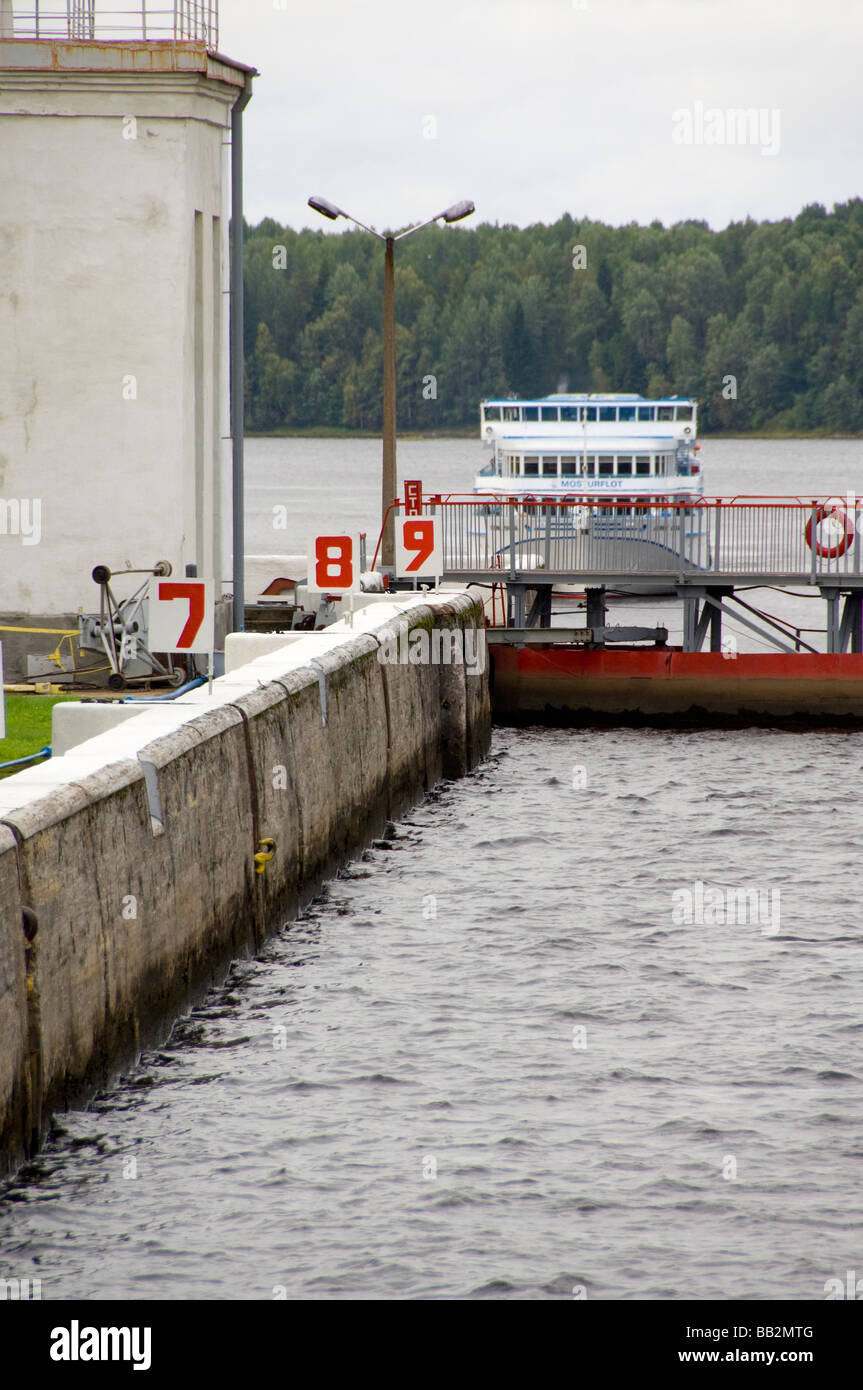 Russia, Svir River (aka The Blue Route), lock area. Riverboat waiting to enter lock. Stock Photo