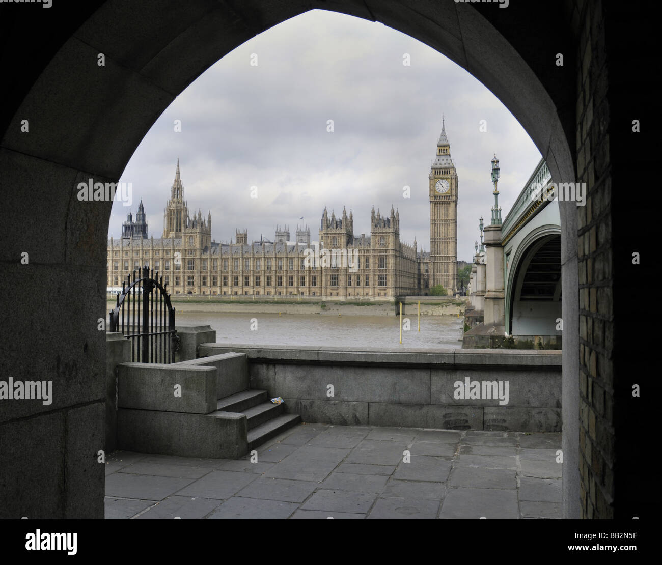 Houses of Parliament through archway across Thames Stock Photo