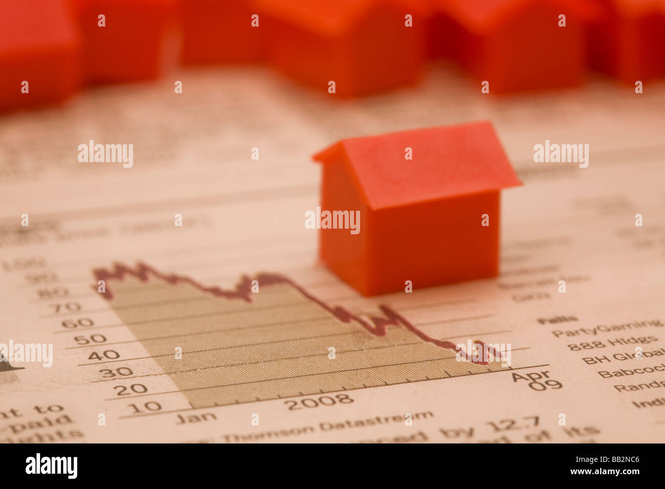 image of the FT with a downward graph and monopoly house depicting the fall in the UK housing market Stock Photo