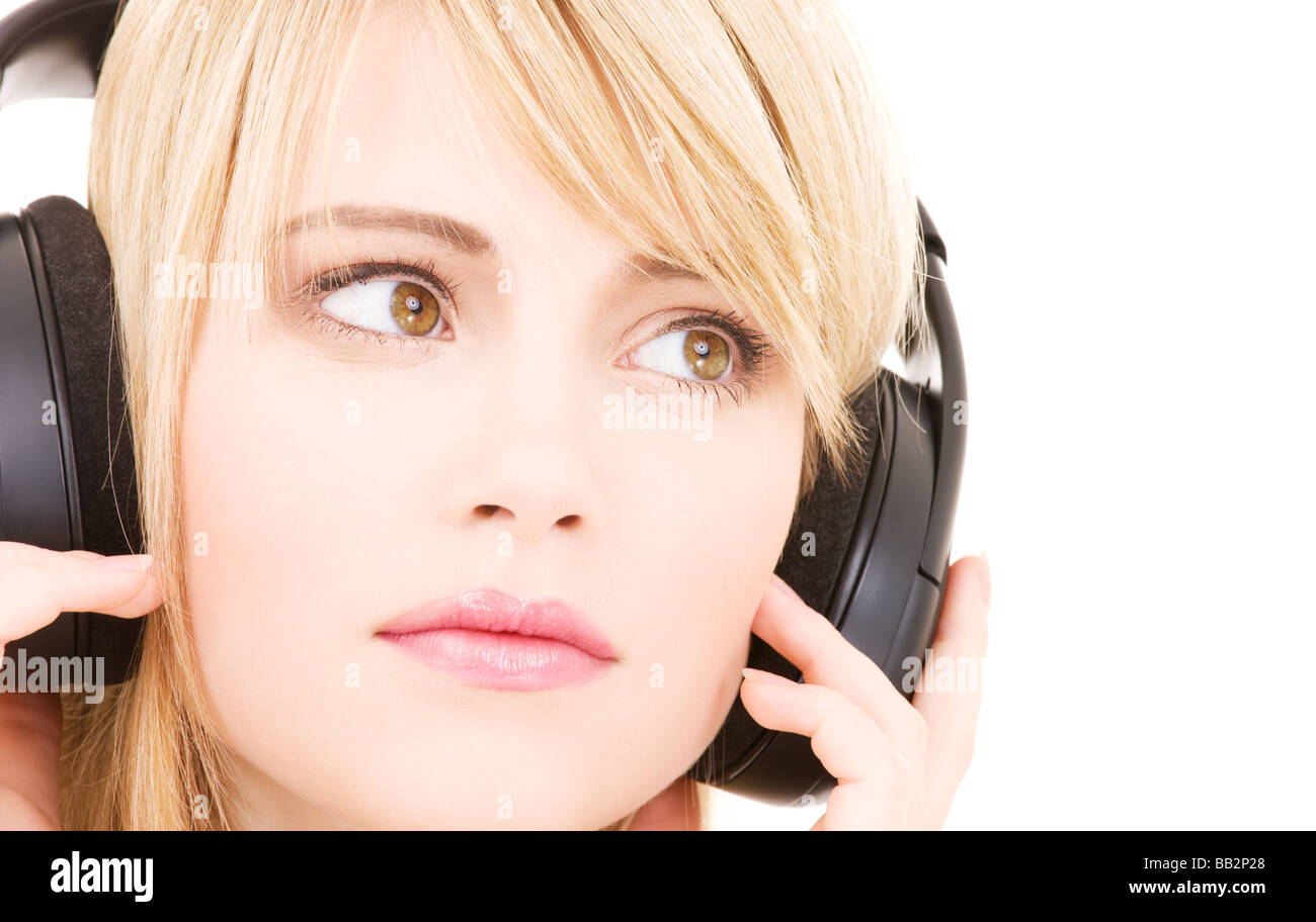 teenage girl in big headphones over white Stock Photo Alamy