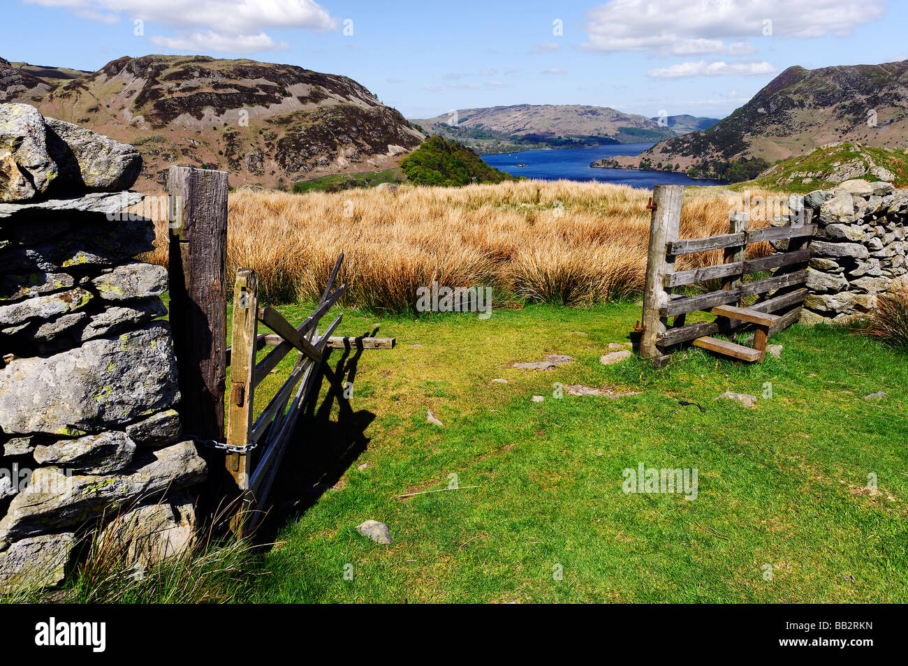 English Lake District, looking down to Ullswater from a gateway on the slopes of Helvellyn above the village of Glenridding Stock Photo