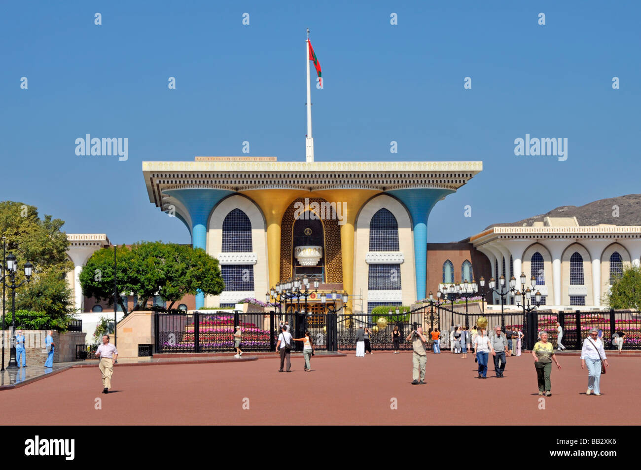 Muscat Oman architecture & tourists outside the  opulent Al Alam Sultans Palace Stock Photo