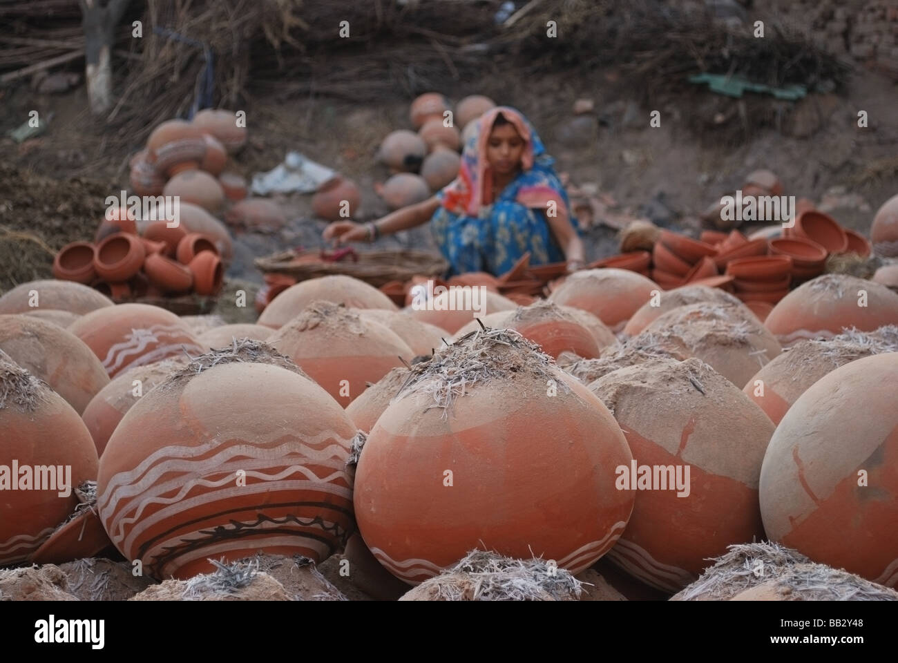 Woman making pots from local clay, India Stock Photo