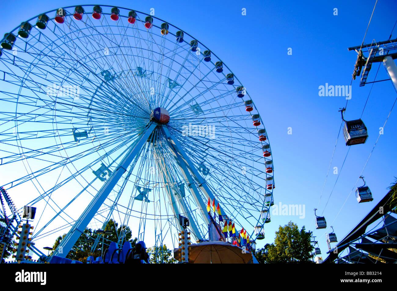 Ferris wheel and skytran at the Texas state fair under the autumn sun Stock Photo: 24039040 - Alamy