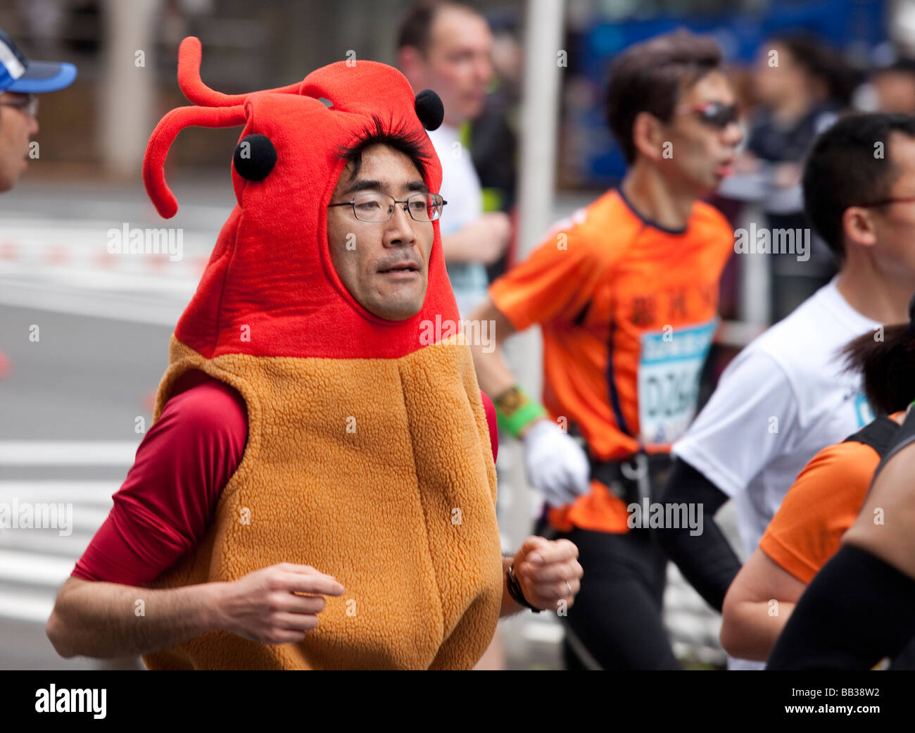 Funny marathon runners in costumes during the 2009 Tokyo Marathon. Stock Photo