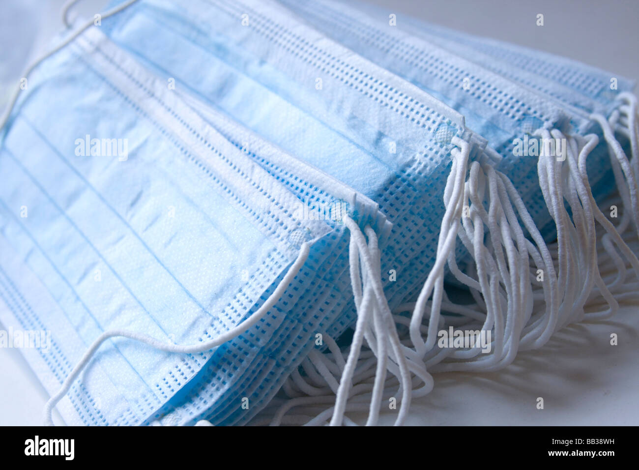 Bunch of blue surgical protection masks. Stock Photo
