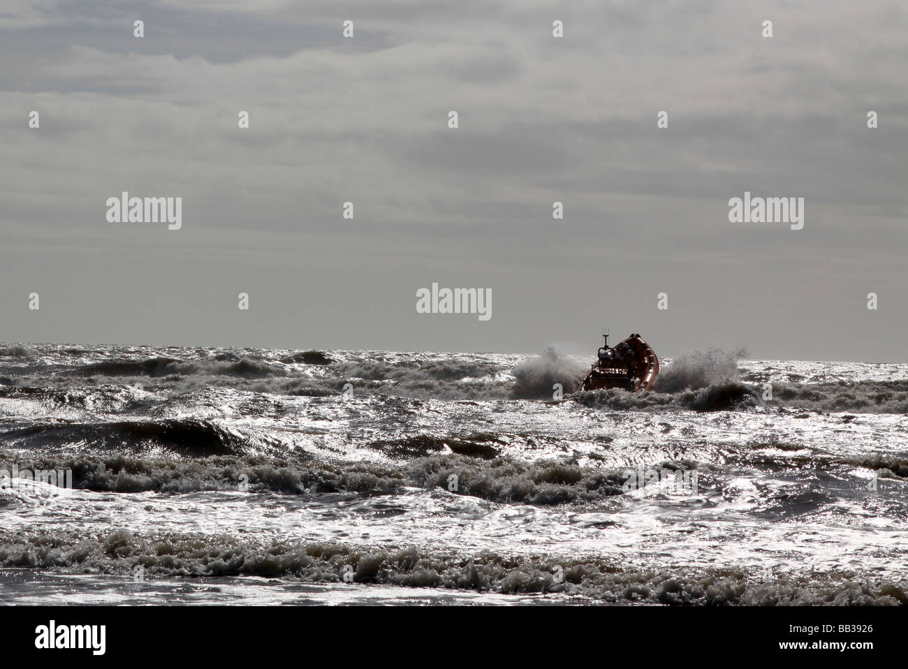 The St Bees Lifeboat jumps through a rough sea on practice maneuvers in winter months of Cambrian coast Stock Photo