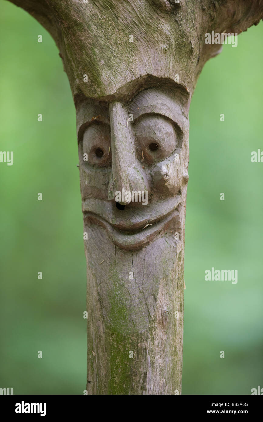 happy face carved in wood Stock Photo