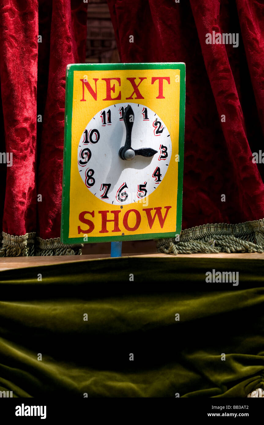 A sign advertising the start of the next Punch and Judy performance. Stock Photo