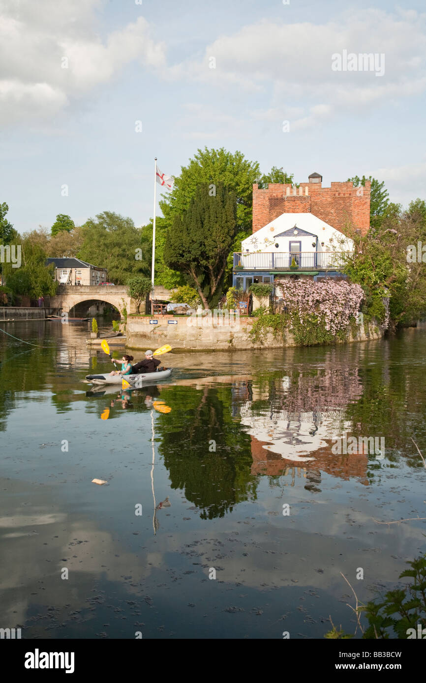 Canoes on the River Thames in front of The Head of the River Pub in